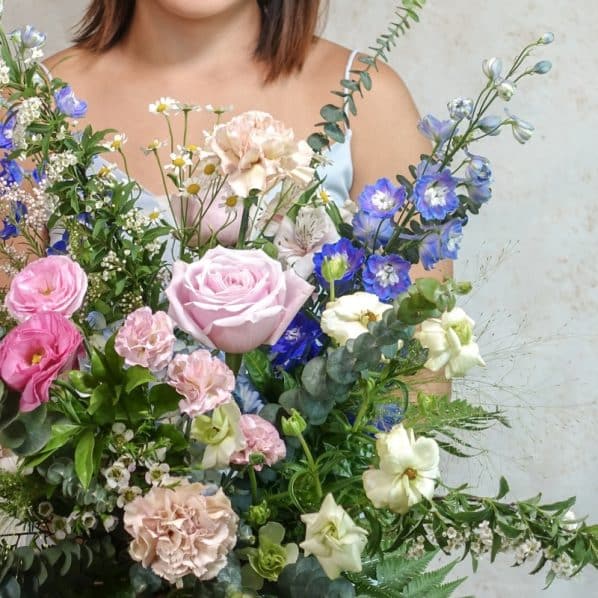 pink and blue flower bouquet garden style