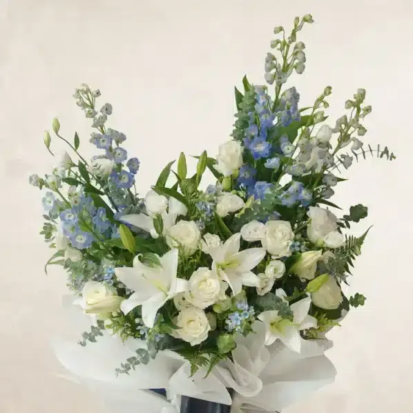 white-and-blue-condolence-flowers-arrangement