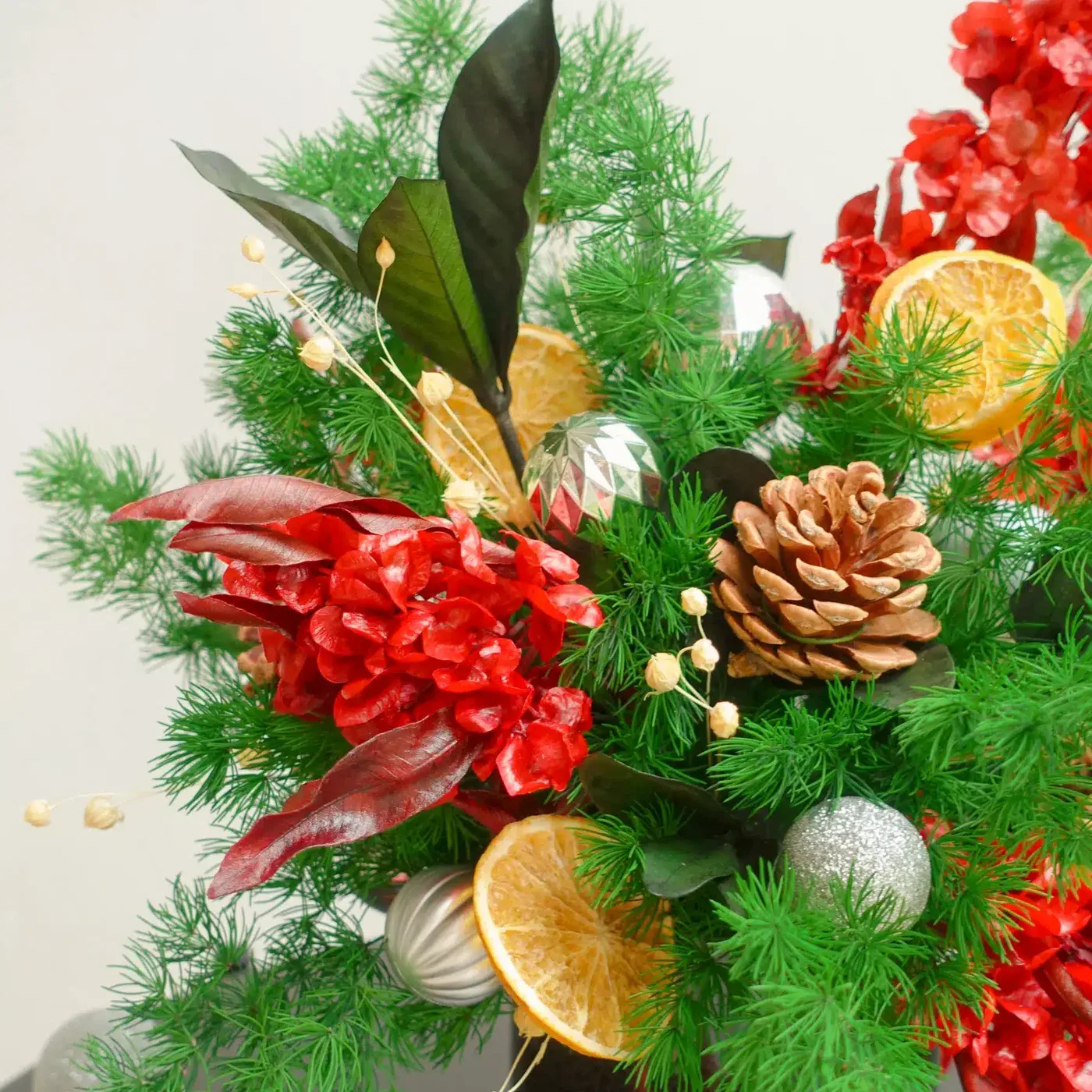 green-red-silver-preserved-flower-christmas-arrangement-close-up