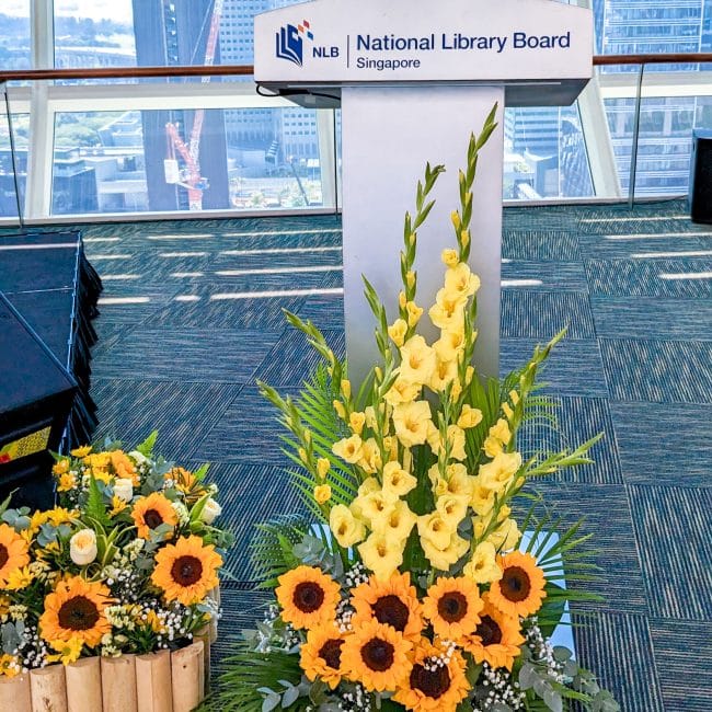 corporate events 02a sunflower rostrum landscaping floral decor 1