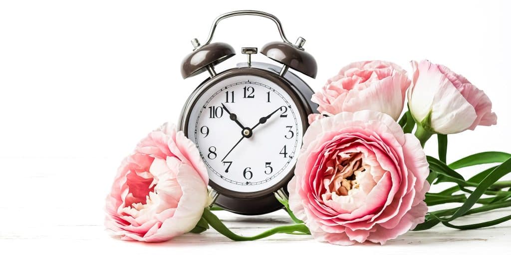an alarm clock with flowers