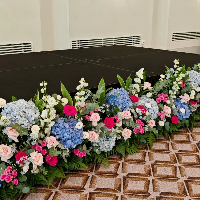 Beautiful floral arrangement with hydrangeas, roses, and greenery.